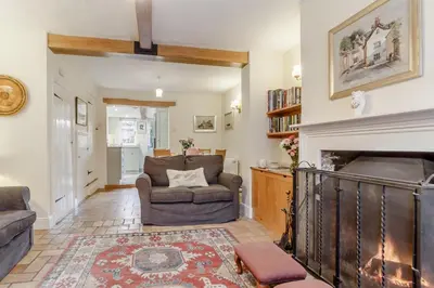 a living room with a couch and a fireplace at 3 Bed in Woodbridge oc-h23 in Woodbridge