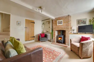 a living room with a couch and a fireplace at 2 Bed in Woodbridge oc-csn2 in Woodbridge