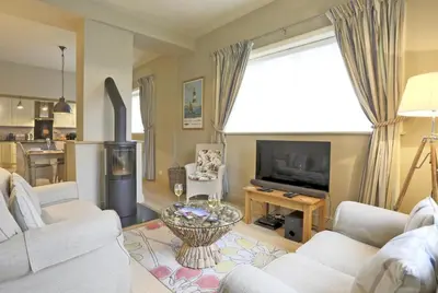 a living room with a couch and a tv at 2 Bed in Orford oc-sfwco in Orford
