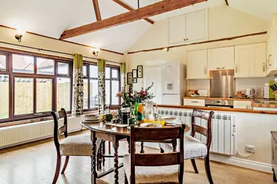 a kitchen with a table and chairs in a room at 1 Bed in St. James South Elmham Halesworth oc-t27361 in Saint James