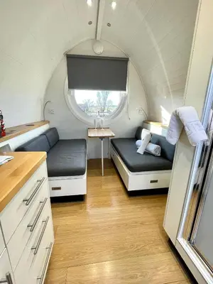 a small room with a bed and a window at Armadilla 1 at Lee Wick Farm Cottages & Glamping in Clacton-on-Sea